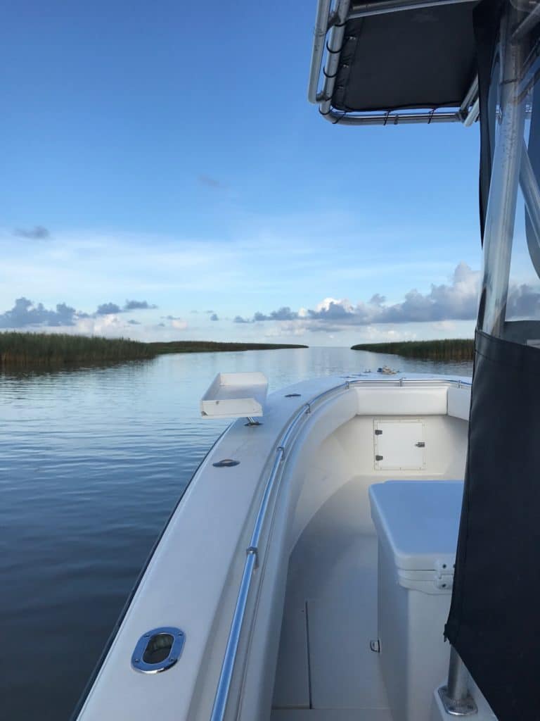 Empty fishing charter boat on glassy water