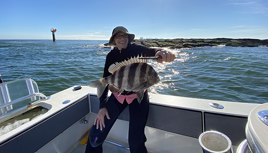 happy-lady-caught-drum-fish