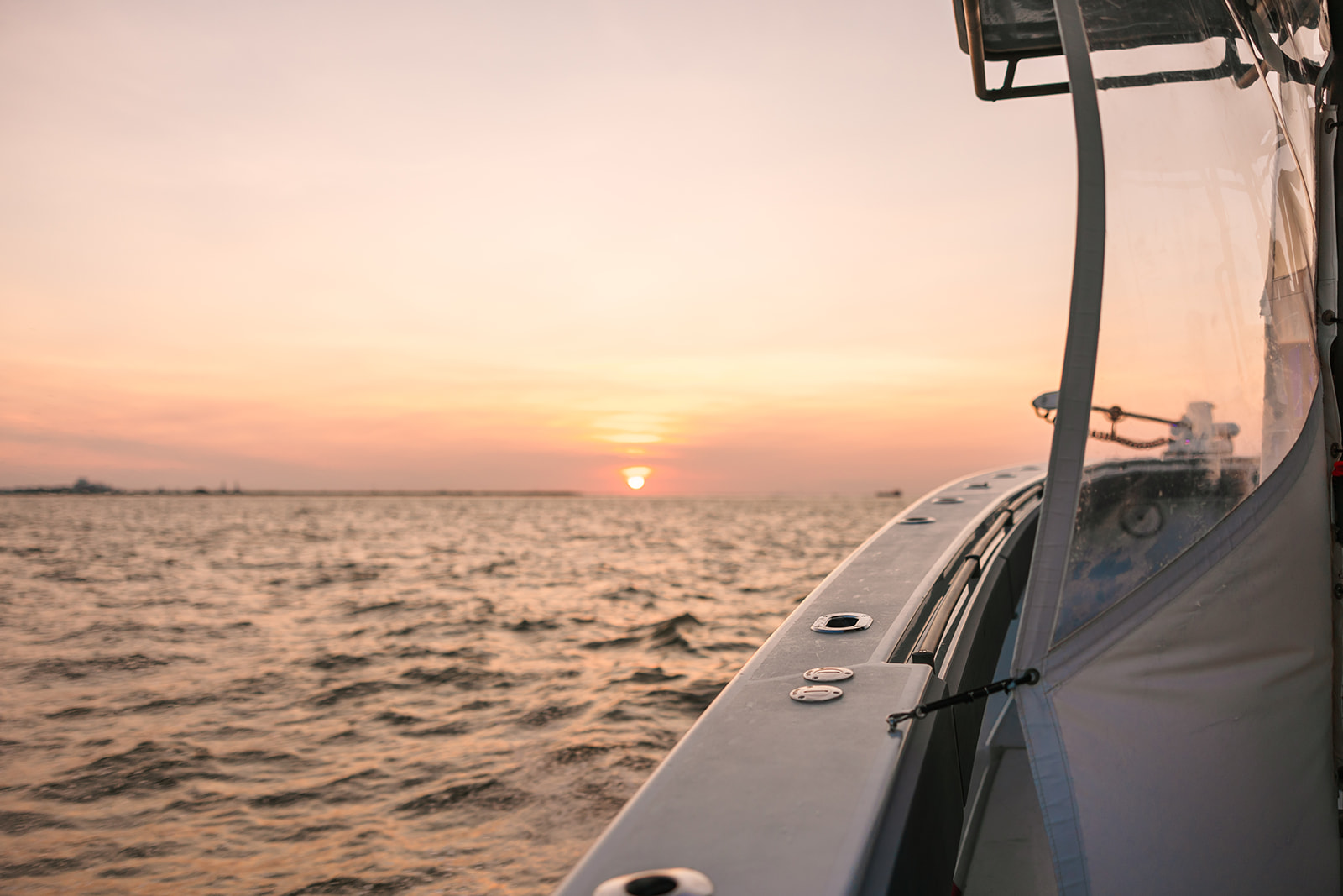 A view of the sunset off the port side of the Galveston Fishing Boat.