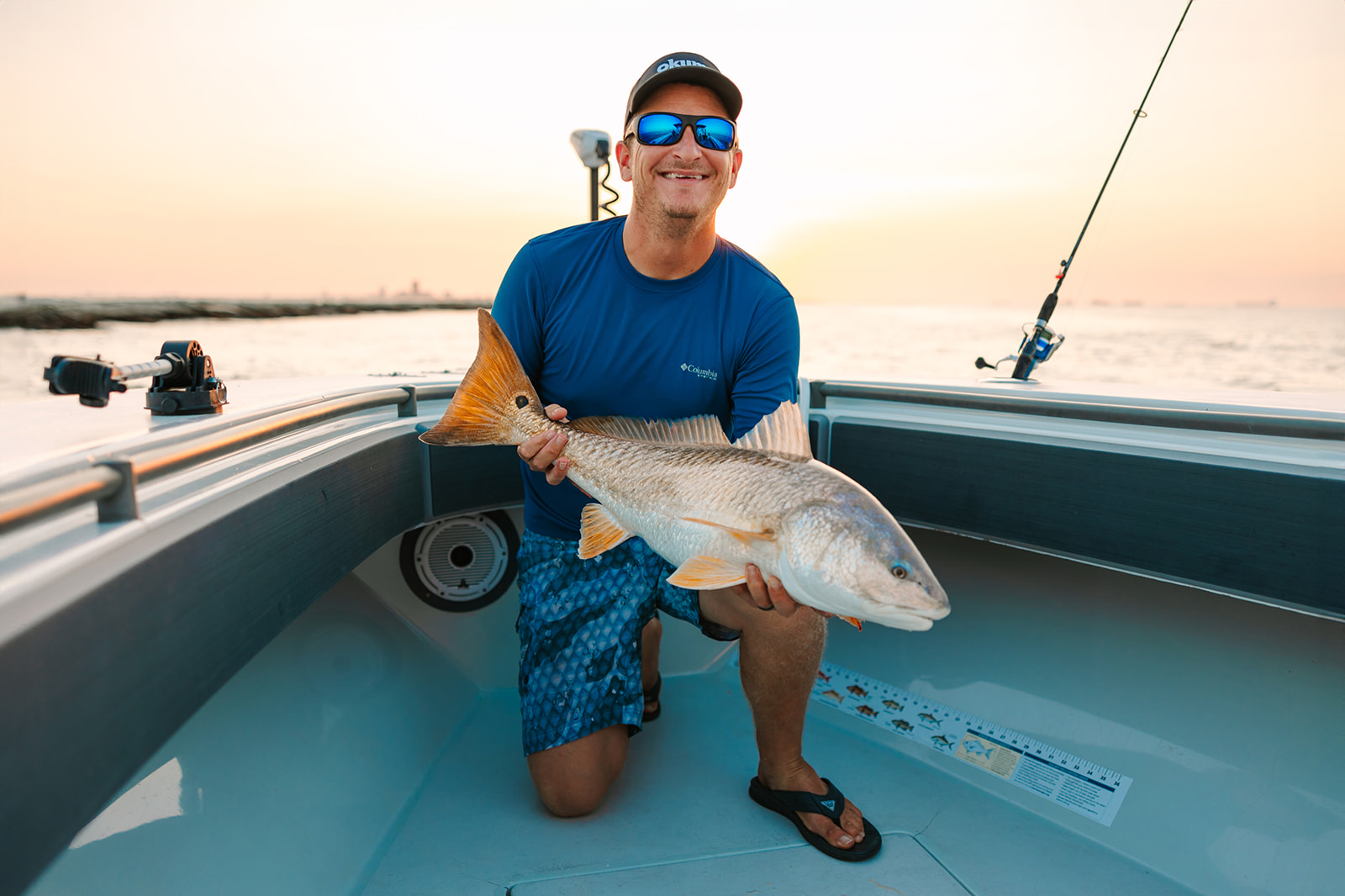 Captain Shane Cantrell poses with a large redfish caught on his Galveston Fishing Charter.